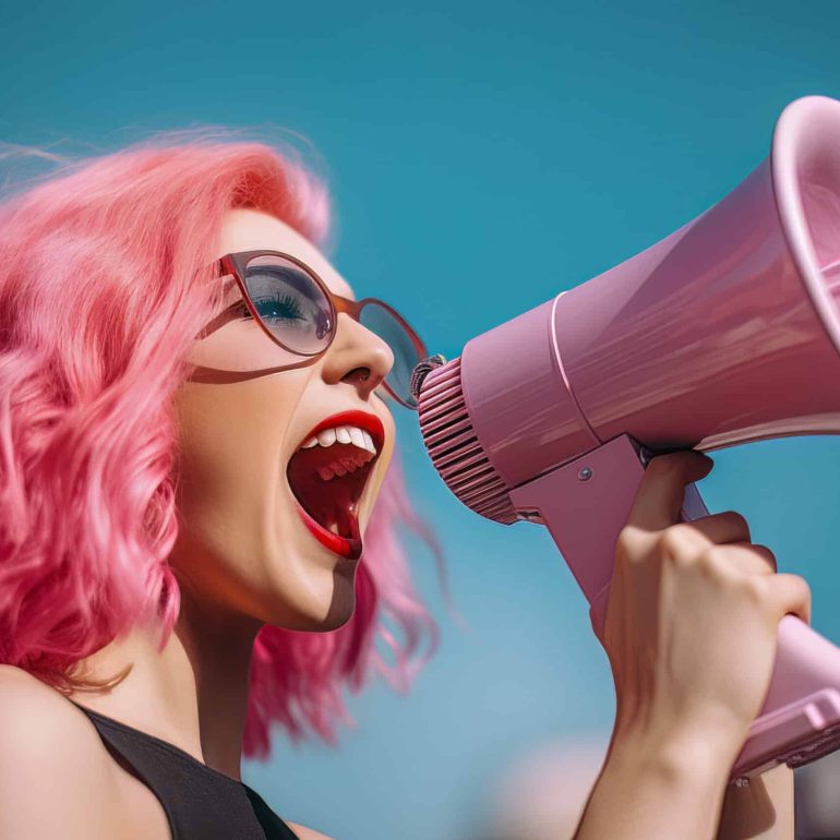 Young Female Entrepreneur with Vibrant Pink Hair Using a Megapho
